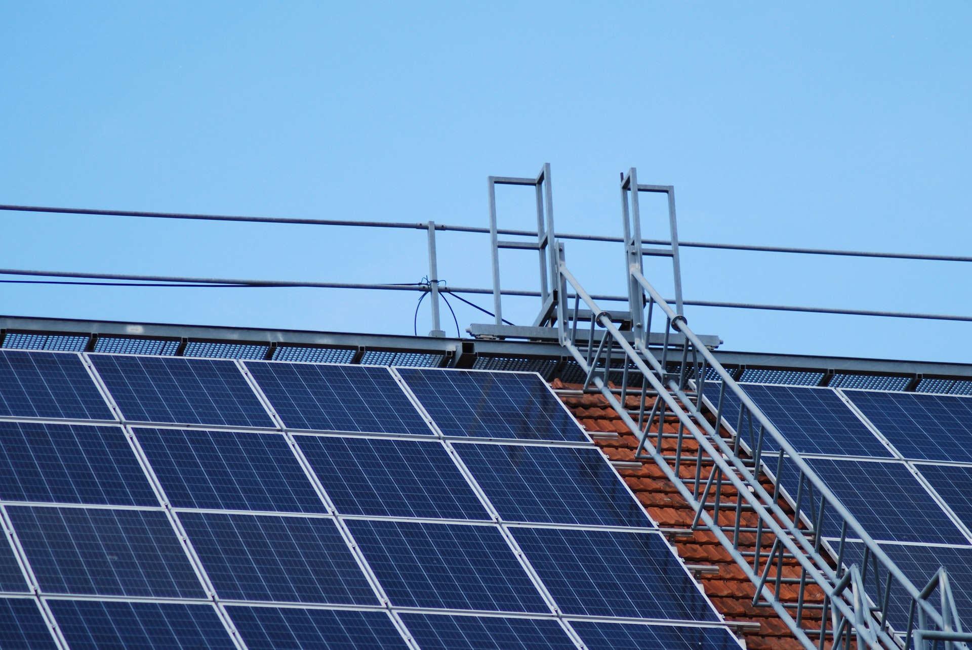 solar panels on gray metal frame under blue sky during daytime
